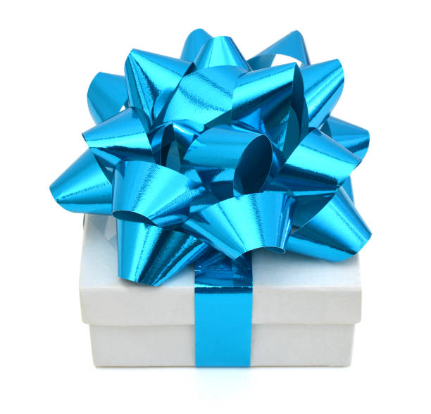 istock Gift box with ribbon and blue bow isolated on the white background, clipping path included. 1145860708