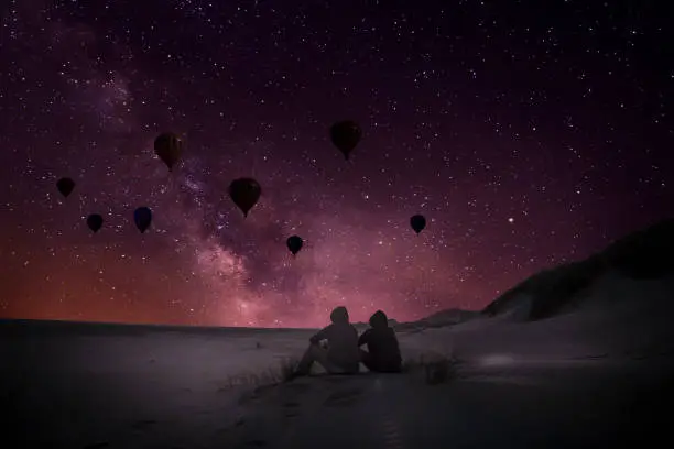 Night sky in desert - Hot air balloons