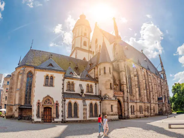 Panoramic view of Architecture and Facade of St. Thomas Church Thomaskirche in Leipzig. Travel tourist and religious destination in Europe