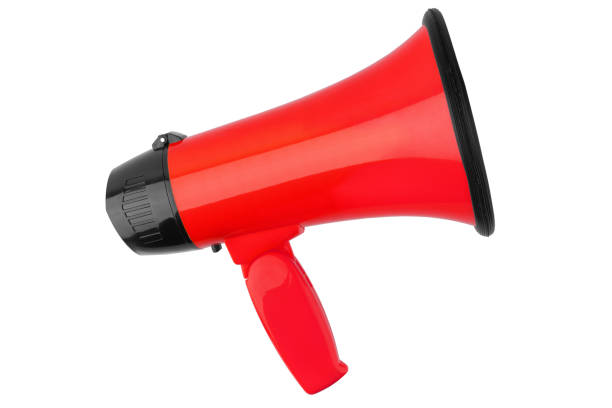 istock Red megaphone on white background isolated close up, hand loudspeaker design, red loudhailer or speaking trumpet illustration, announcement or agitation symbol, media or communication icon, alert sign 1145862384
