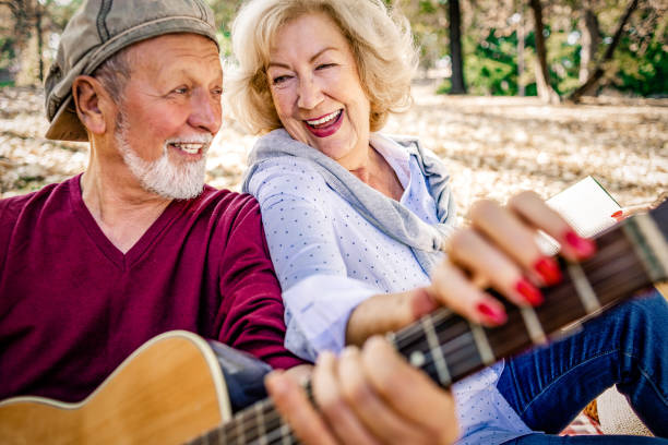 istock cheerful senior couple enjoying picnic together 1145863433