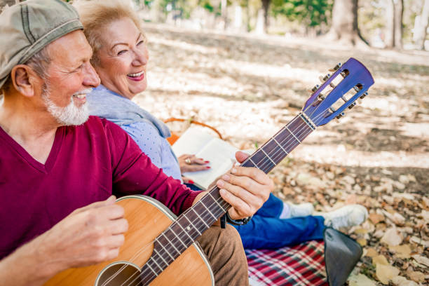istock cheerful senior couple enjoying picnic together 1145863742
