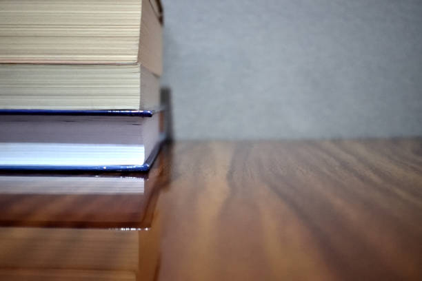 istock books on a wooden table 1145864158