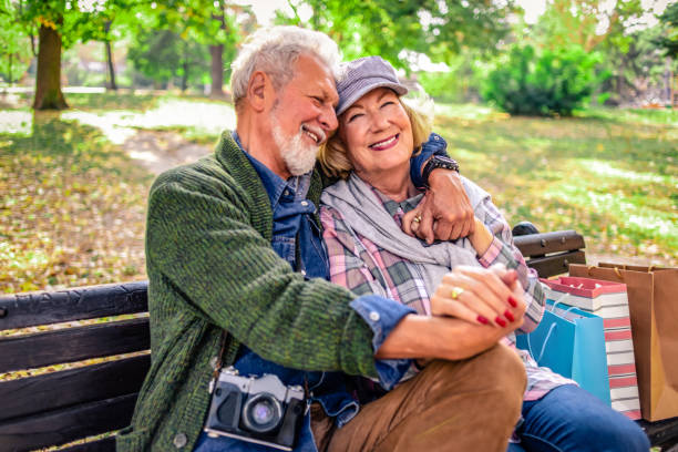 istock playful senior couple having fun together in nature 1145864843