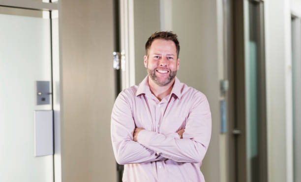 istock Businessman standing in office hallway 1145865185