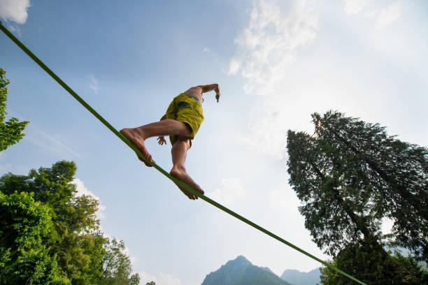 Sporty boy practices walking on the rope