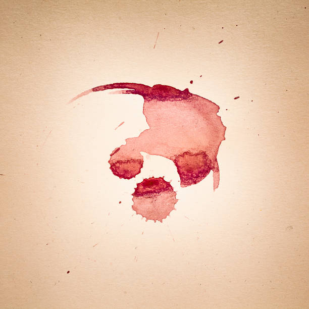 Shot glass with spilled liquid on a white background