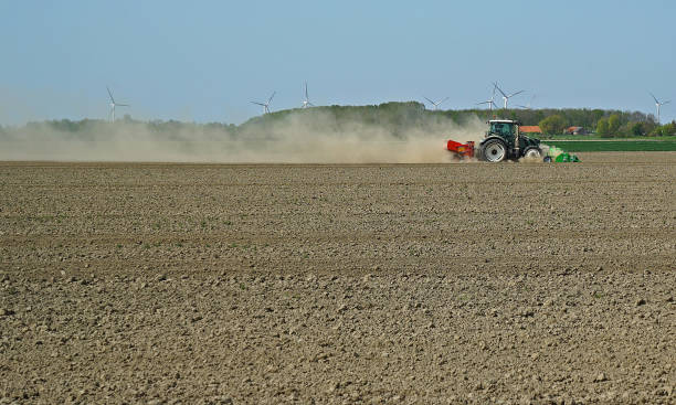 istock Cloud of dust behind a ploughing tractor during springtime in Noord Beveland 1145868588