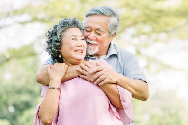 istock Senior couple smiling while holding each other 1145868962
