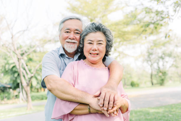istock Senior couple smiling while holding each other 1145869005