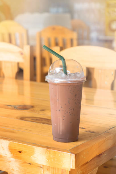 istock Iced chocolate milkshake, Summer refreshment drinks on wooden background in cafe , background 1145872557