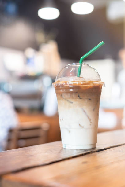 istock Iced latte coffee on wooden table in restaurant and cafe , background 1145872594