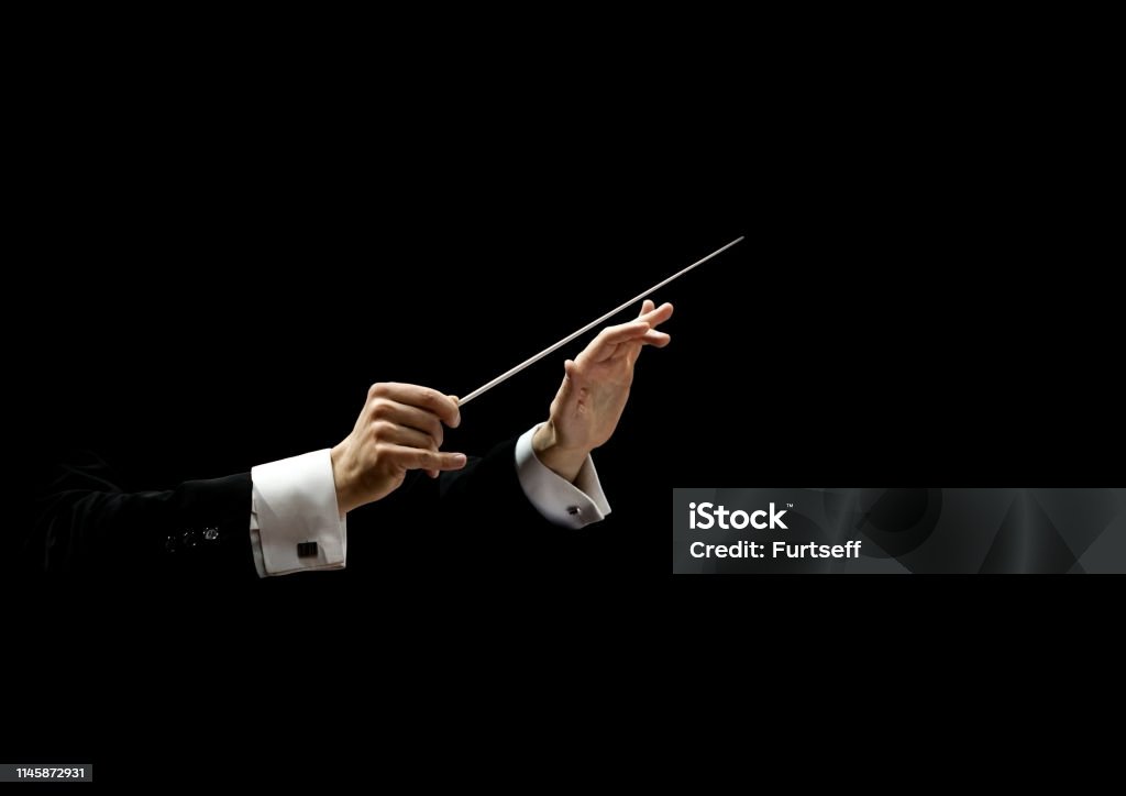 Hands of conductor Hands of conductor on a black background Musical Conductor Stock Photo
