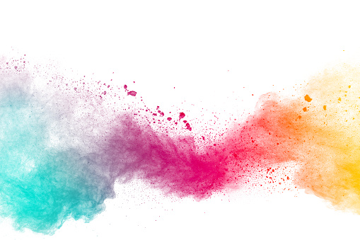 Explosión de polvo multicolores abstracta sobre fondo blanco. El polvo colorido explota. Festival de polvo Holi pintado. photo