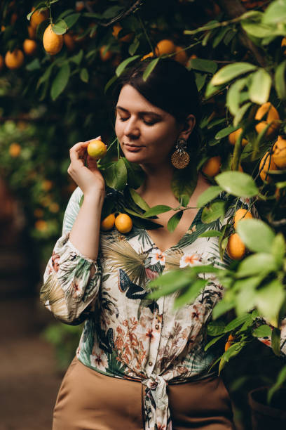 istock Woman among plants in lemon gardens 1145875304