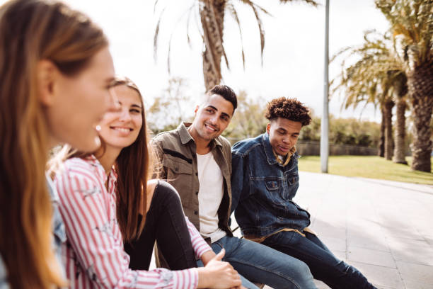 istock friends talking together on a bench 1145875456