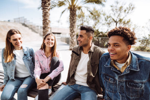 istock friends talking together on a bench 1145875561
