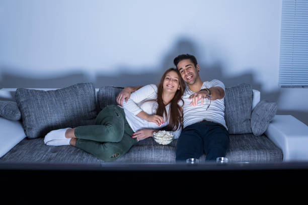 istock Young couple watching TV 1145877585