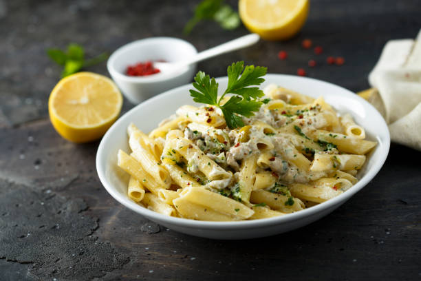 Pasta Pasta with olives and lemon sauce ricotta photos stock pictures, royalty-free photos & images
