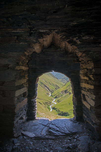 View of the valley through the fortress window. Location - Tusheti region of Georgia. Dartlo tower.