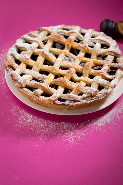 istock Fresh sweet pie on pink background 1145880339