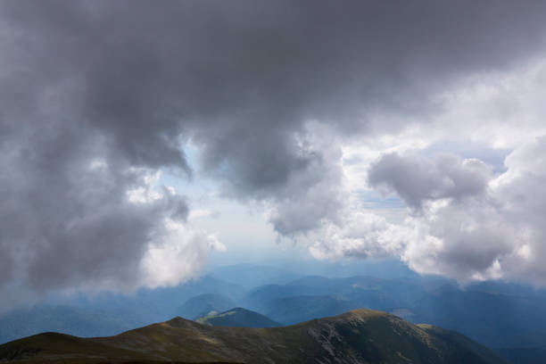 istock Dramatic cloudscape and mountain scenery in the Transylvanian Alps in summer, with rain clouds 1145881960
