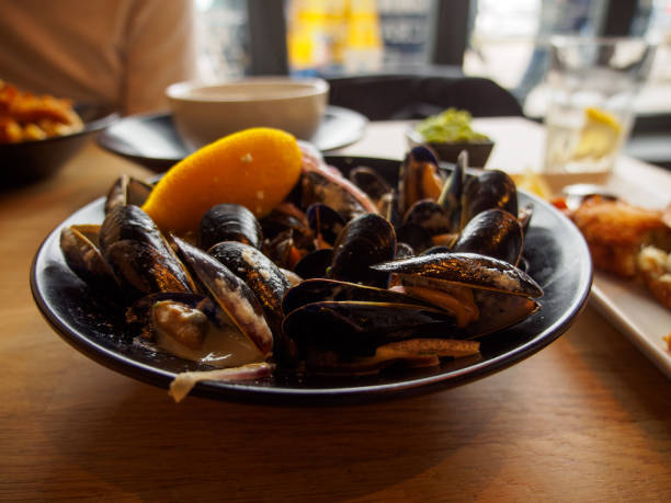 istock Cornish cream mussels at restaurant, St. Ives, England 1145883580