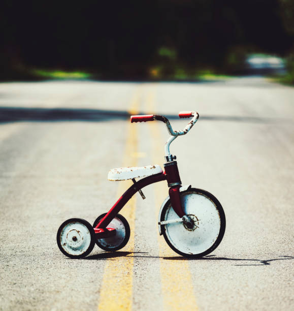 istock Forgotten Tricycle on Road 1145883826