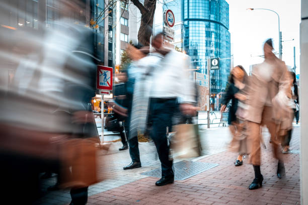 istock Blurred business people on their way from work 1145885400