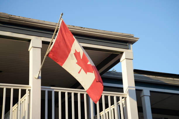 canadian flag on balcony. - canadian flag fotos imagens e fotografias de stock