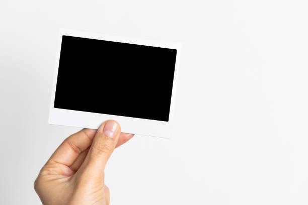 istock Hand Holding Instant Photo 1145888838