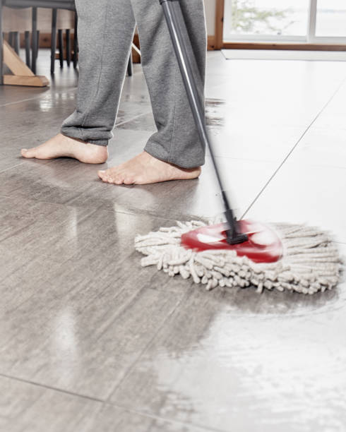 istock Spring cleaning time. A man cleaning his tiled kitchen floor with a mop. 1145890314
