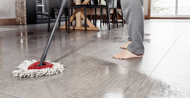 istock Spring cleaning time. A man cleaning his tiled kitchen floor with a mop. 1145890315