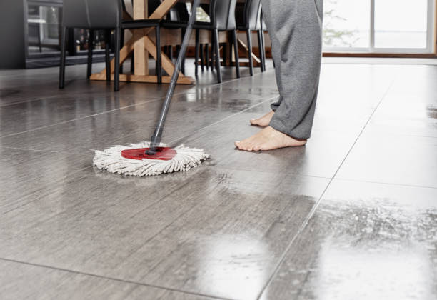 istock Spring cleaning time. A man cleaning his tiled kitchen floor with a mop. 1145890323