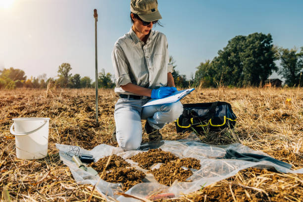 istock Soil Test. Female Agronomist Taking Notes In The Field 1145891219