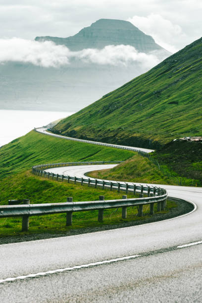 istock winding road at the faroe islands 1145891308