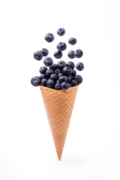 istock in the ice cream cone, a cascade of fresh blueberries 1145894960