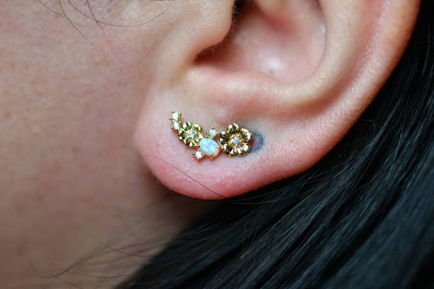 istock Young Woman with Opal Earring 1145895193