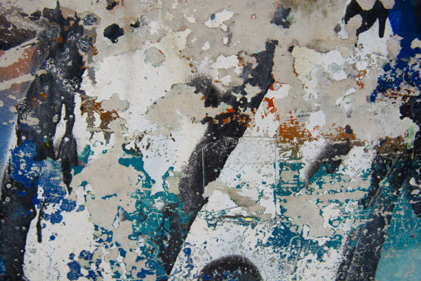istock Cracked and peeling colorful paint, grunge old wall texture. Tempalte for design 1145897927