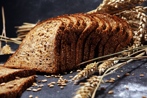 istock bread on black board from above. Kitchen or bakery poster design with bread. 1145899063