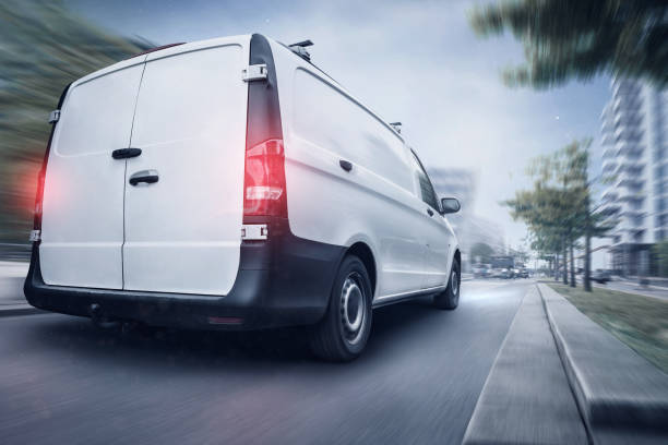 istock Commercial van driving quickly through the night 1145899965