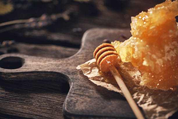 istock Honey Dipper and honyecomb 1145900061