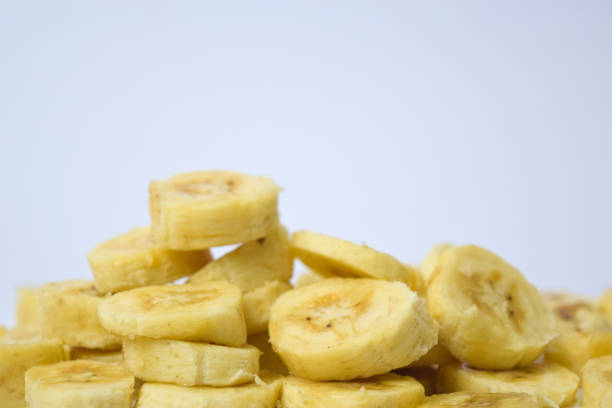 istock Close up slice yellow banana isolated on white background 1145900979