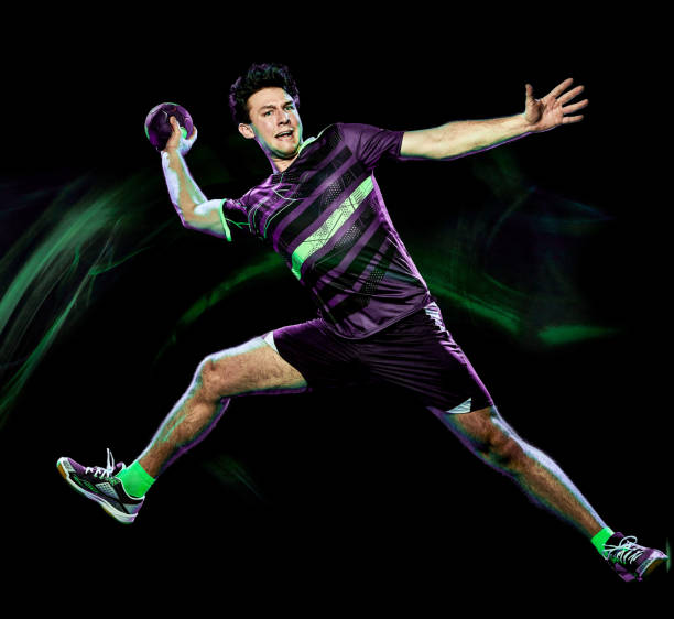 istock handball player young man isolated speed light painting 1145901324