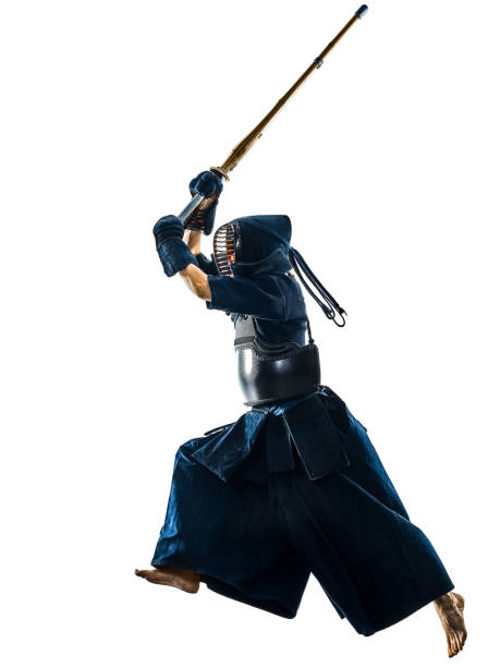 Kendo martial arts fighters woman silhouette isolated white bacground one woman  Kendo martial arts fighters combat fighting in silhouette isolated on white bacground kendo stock pictures, royalty-free photos & images
