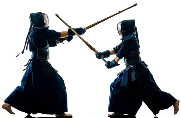 istock Kendo martial arts fighters silhouette isolated white bacground 1145901364