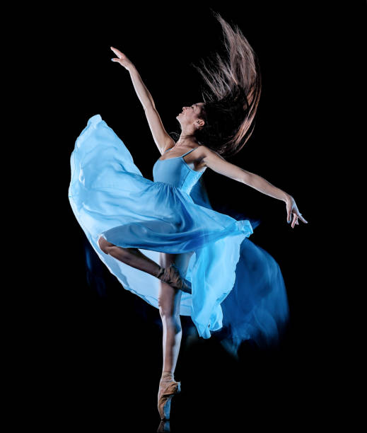 istock young woman ballet dancer dancing isolated black background light painting 1145901408