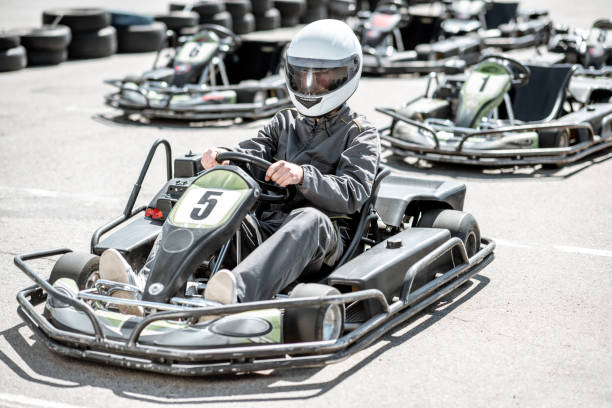 istock Man driving kart on the track 1145903426