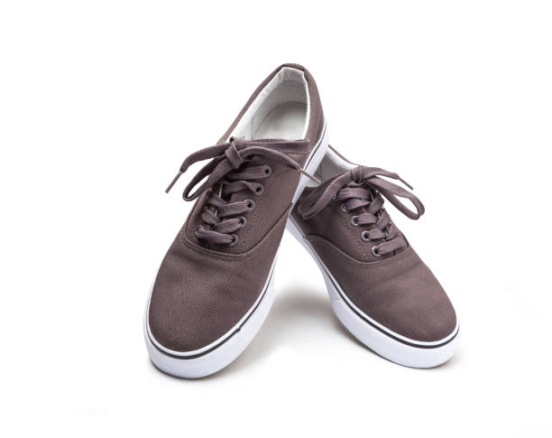 istock A pair of brown canvas shoes isolated on white 1145904414