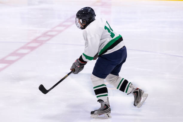 istock Mature woman playing hockey 1145906063